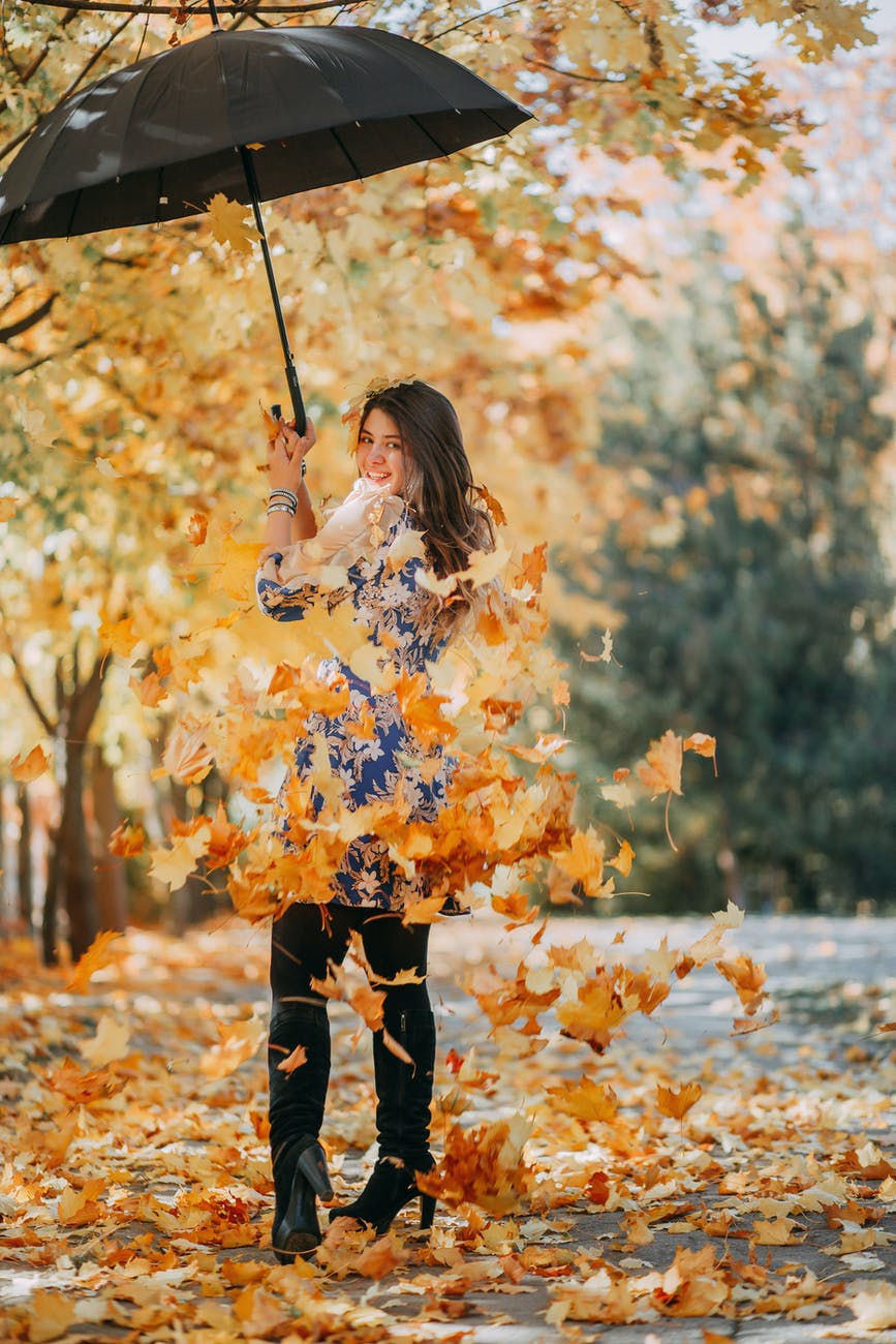 photo of woman holding umbrella